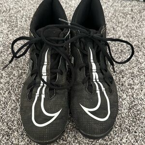 Nike Black Athletic Cleats with White Swoosh Accents